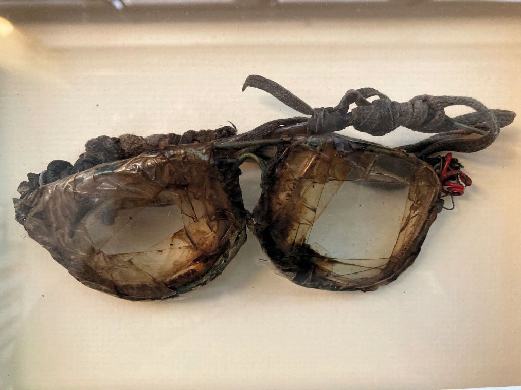A pair of old broken glasses