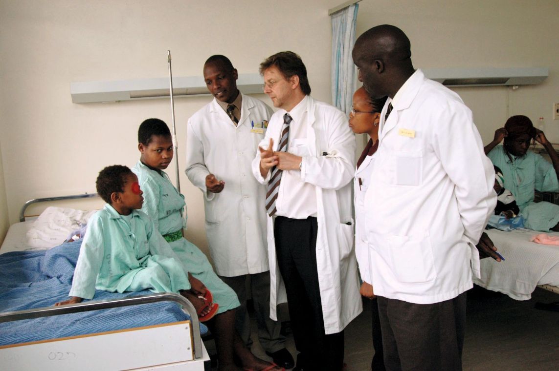Doctors with patients in a hospital room