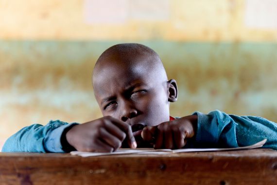 A boy squinting his eyes