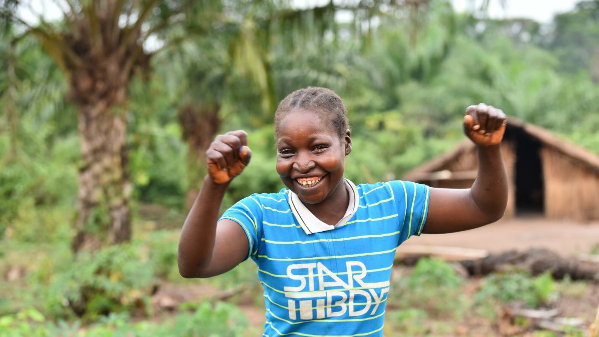 A woman raising her hands in victory