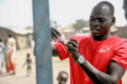 Samuel Lubari, a trachoma project officer in CBM&#039;s South Sudan country office, is preparing liquid azithromycin antibiotic to treat trachoma infection in children.
