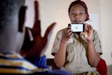 A woman holding a smartphone 